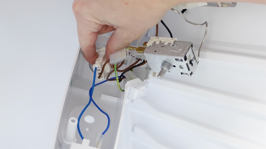 Remove current light holder socket by twisting anti-clockwise and pulling away